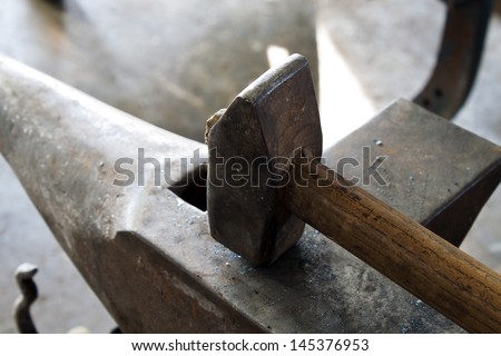 Anvil with Hammer - stock photo