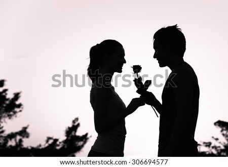 stock photo male giving a flower to a girl love concept 306694577