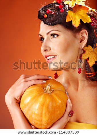 Holding A Pumpkin