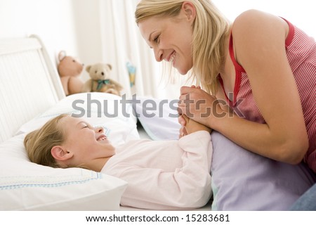 Old man with young women in bed Old man with young women in bed