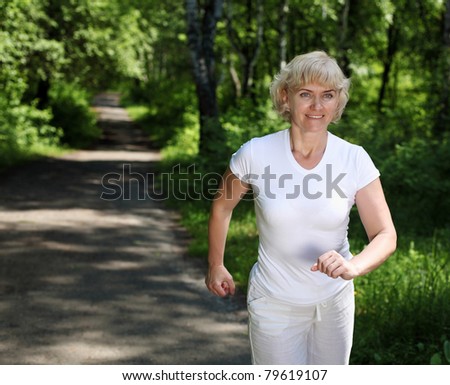 Elderly woman likes to run in the park. Healthy lifestyle - stock ...