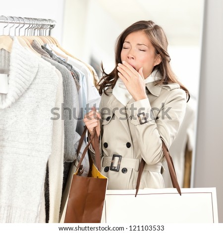 Only,One Young Woman Only,Only Women,People,Photography,Ponytail,Real People,Red,Retail,Shopping,Side View,Small Business,Spending Money,Standing,Store