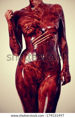 Holly naked and covered in chocolate