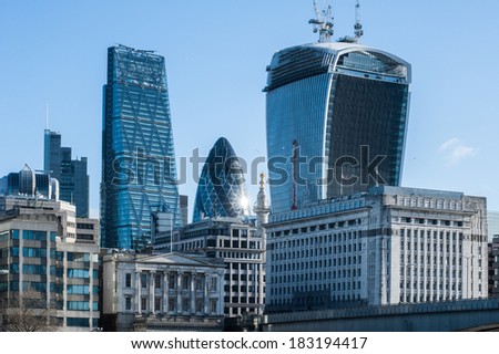 stock-photo-skyscrapers-of-the-city-in-london-at-sunrise-in-buildings-include-leadenhall-street-aka-183194417.jpg