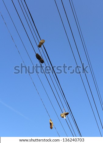 Shoes hanging from power lines are said to be gang symbols or the