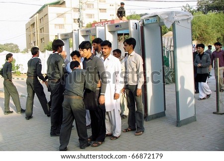 KARACHI, PAKISTAN - DEC 08: Volunteers take body search of people who
