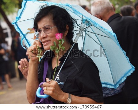  - stock-photo-ubon-ratchathani-thailand-mar-unidentified-woman-in-black-dress-holding-a-rose-for-173955467