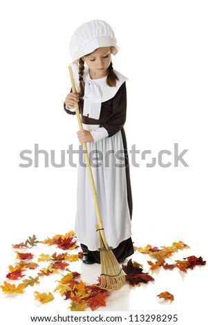 stock-photo-an-pretty-elementary-pilgrim-girl-raking-colorful-autumn-leaves-on-a-white-background-113298295.jpg