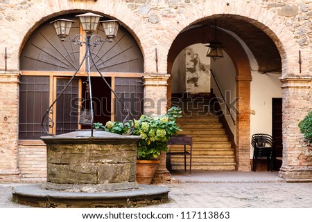 The Old Water Well in Montalcino, Tuscany, Italy - stock photo