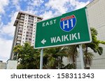 a highway sign points in the...