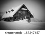 old  wooden  snowy ski lodge in ...