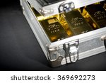 stock-photo-aluminum-case-full-of-gold-bars-369692273.jpg