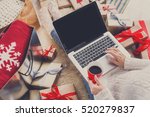 stock-photo-christmas-online-shopping-top-view-female-buyer-with-laptop-copy-space-on-screen-woman-has-520279837.jpg