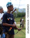 Small photo of Negeri Sembilan, Malaysia - 14th December 2014 : A malay man getting ready to shoot an arrow during an event Temasya Zaman Kegemilangan Empayar Melayu