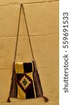 Small photo of Handmade traditional carpetbag is hanging on the wall in Gaziantep, Turkey.