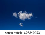 Small photo of Lonely cloud up in the blue sky