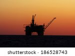 oil platform silhouette in gulf ...