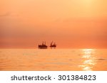 silhouette of oil platform at...
