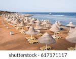 Small photo of Chaises lounges on the beach sea. Summer