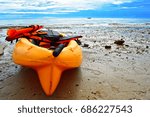 Small photo of The kayak was placed on the beach during the full tide.