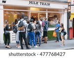 Small photo of London, UK - 30 August 2016: People wait in line to buy ice cream from the Milk Train in London. They serve three types of ice cream: vanilla, matcha and hojicha and they put it on candyfloss.