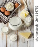 Small photo of Fresh Milk products on a wooden background.Top view