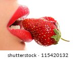 Profile of a female mouth with a strawberry against white background - stock photo