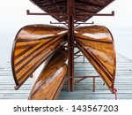 wooden rowboat is hanging in...