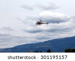 civil helicopter flies in the...