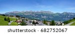 Small photo of The mountain chain of the Churfirsten in the canton of St. Gallen in Switzerland, in the foreground houses, panorama/Panoramic of the mountain chain Churfirsten
