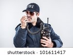 Small photo of Federal agent calling it in for back up on vintage radio during an emergency going down