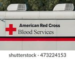 Small photo of SANTA CLARITA, CA/USA - JULY 29, 2016: American Red Cross Bloodmobile and logo. The American National Red Cross is a humanitarian organization that provides emergency assistance in the United States.