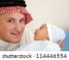 Man Holding Newborn