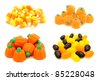 Four individual piles of Halloween candy - candy corn, gummy pumpkins, jelly pumpkins and jelly beans - stock photo