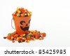 Bucket of Halloween Candy on White, Copy Space - stock photo