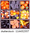 Halloween candy arranged in a printers box, assorted varieties - stock photo