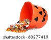 child halloween pumpkin bucket spilling candy - stock photo