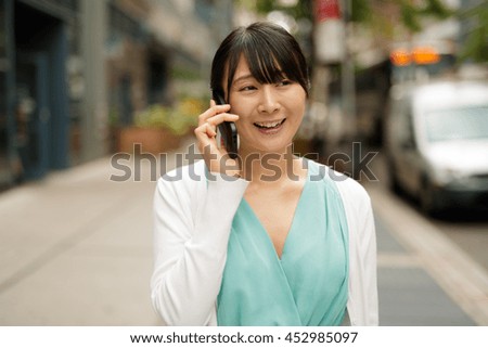 https://thumb10.shutterstock.com/display_pic_with_logo/1051921/452985097/stock-photo-young-asian-woman-walking-talking-on-cell-phone-452985097.jpg