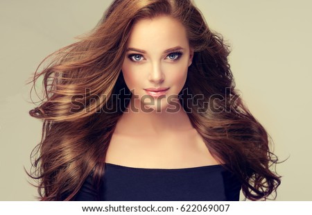 https://thumb10.shutterstock.com/display_pic_with_logo/1054231/622069007/stock-photo-brunette-girl-with-long-and-volume-shiny-wavy-hair-beautiful-model-with-curly-hairstyle-622069007.jpg