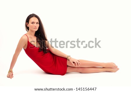 http://thumb10.shutterstock.com/display_pic_with_logo/1179395/145156447/stock-photo-beautiful-brunette-woman-in-red-dress-posing-fashion-in-studio-woman-lying-down-145156447.jpg