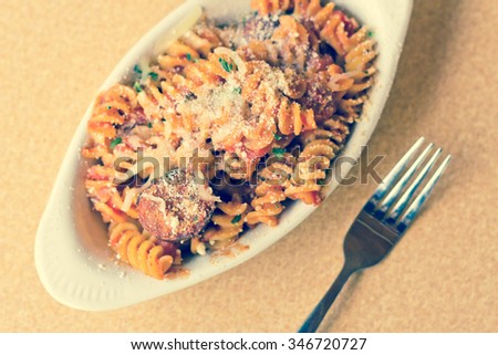 spiral pasta parmesan fresh peppers beef delicious mexican sausage romano tomato sauce cheese shutterstock