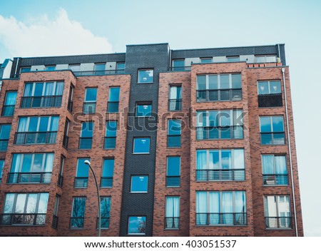 Modern Brick Apartment Building low angle architectural exterior modern commerical stock photo Modern Brick Apartment Building low angle architectural exterior modern commerical stock photo