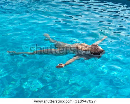 Young Woman Submerded In A Swimming Pool Stock Photo 