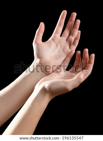 Human hands on black background - stock photo