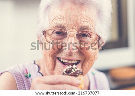 Woman Decorating Cupcakes old woman making decorating cupcakes stock photo 215748847 Woman Decorating Cupcakes old woman making decorating cupcakes stock photo 215748847