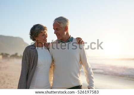 https://thumb10.shutterstock.com/display_pic_with_logo/163108/526197583/stock-photo-outdoor-shot-of-loving-senior-couple-having-a-walk-on-the-beach-at-the-sunset-526197583.jpg