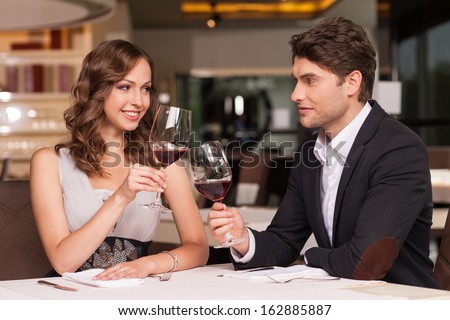 https://thumb10.shutterstock.com/display_pic_with_logo/1672675/162885887/stock-photo-loving-couple-celebrating-at-the-restaurant-looking-happy-and-romantic-162885887.jpg