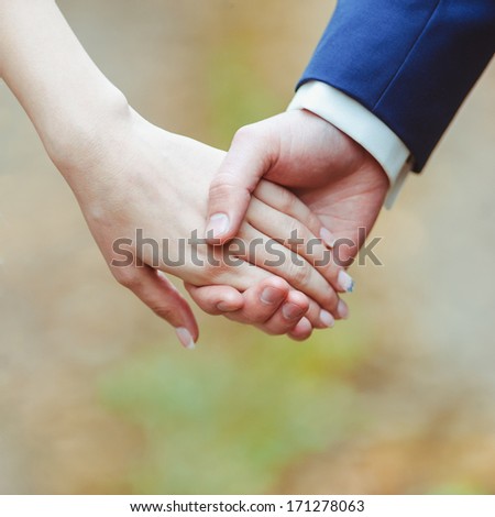 https://thumb10.shutterstock.com/display_pic_with_logo/1756370/171278063/stock-photo-close-up-image-of-a-young-loving-couple-holding-hands-171278063.jpg