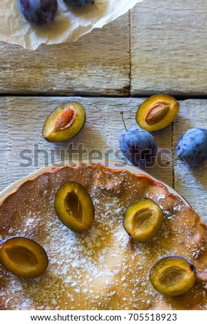 Rustic Plum Cake On White Wooden Background Rustic Plum Cake On White Wooden Background
