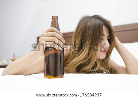 Download Drunk Woman On Bed Bottle Hand Stock Photo 176584934 ... Yellowimages Mockups